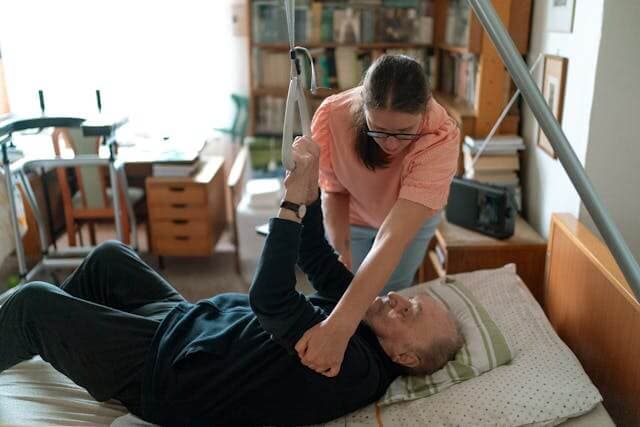 Caregiver assisting an elderly person